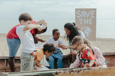 group of children playing on the beach eco sustainability save the world eco values