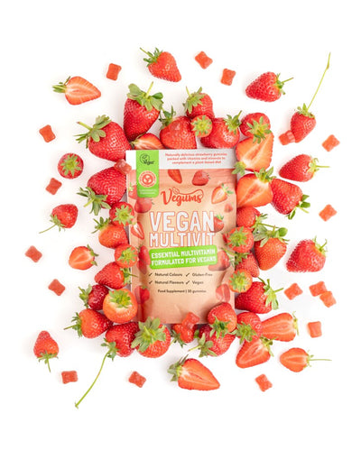 vegums vegan multivitamin pouch with gummies inside and fresh fruit