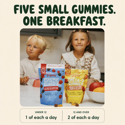 Two young children at the breakfast table with Vegums kids gummy pouches, suitable from age 3