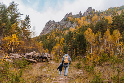 vegums autumn wellness family walking in mountains