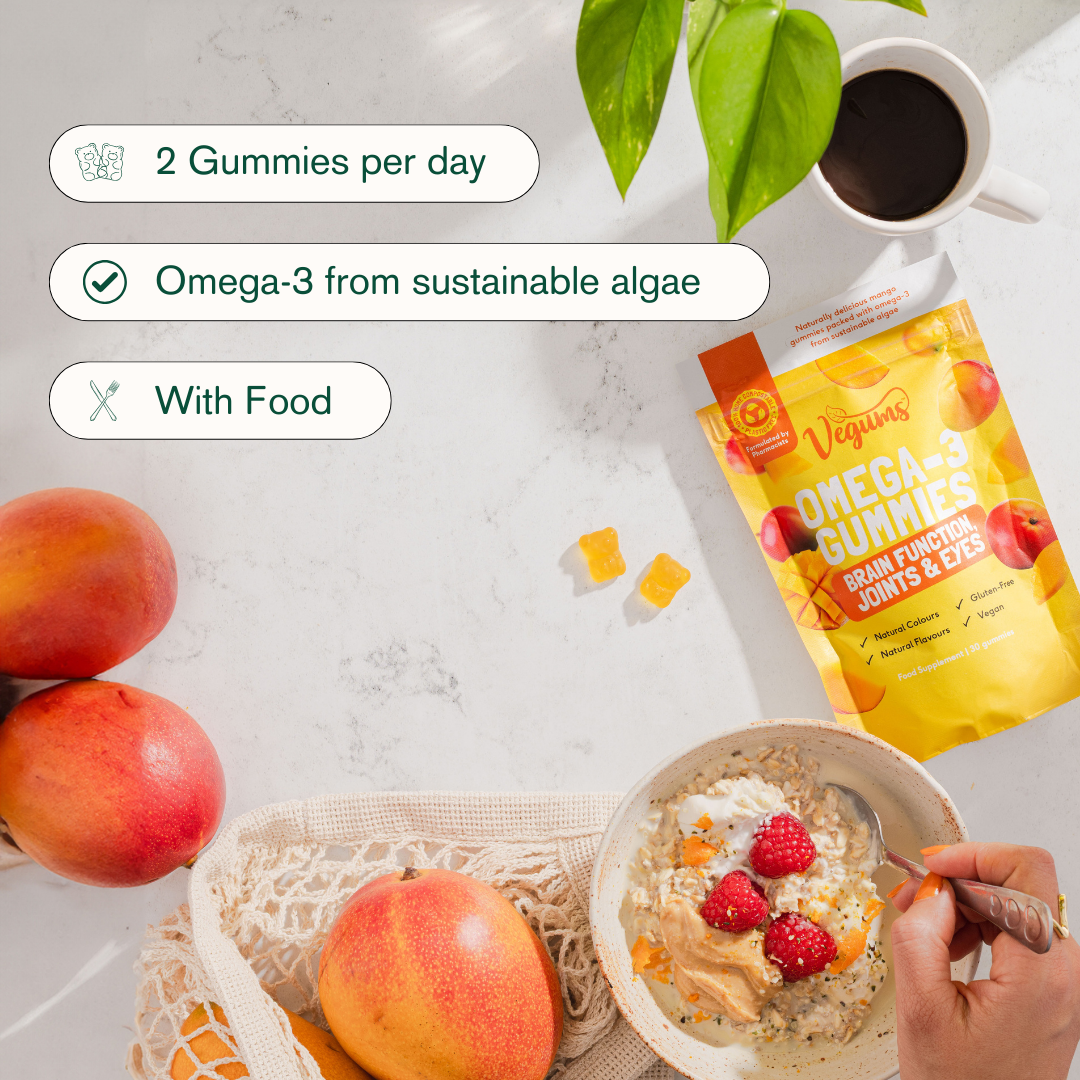 Vegums fish free omega 3 gummy vitamins packet with instructions detailed marble background with fruit and cereal bowl 