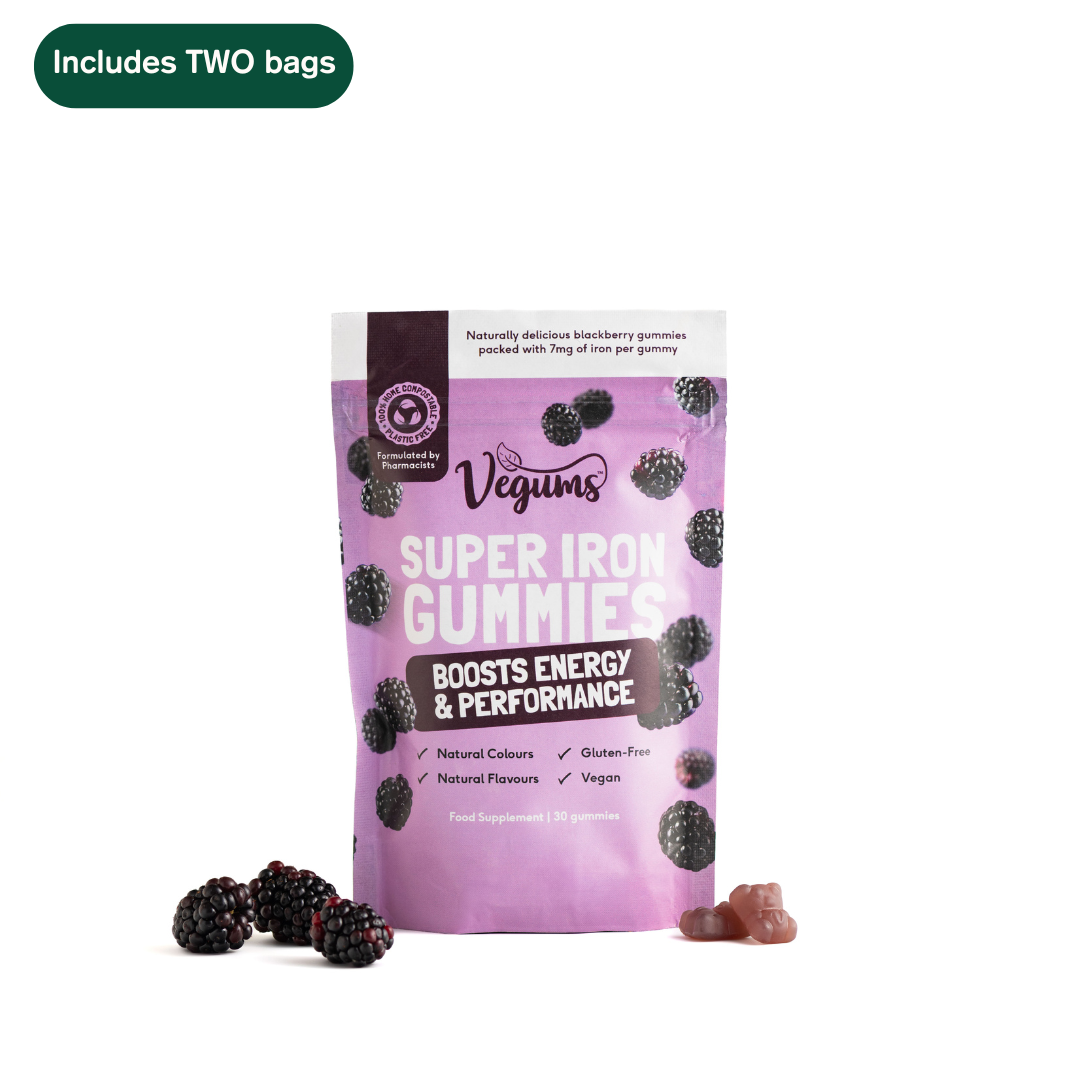 Purple package of Vegums Super Iron Gummies with blackberries on a white background