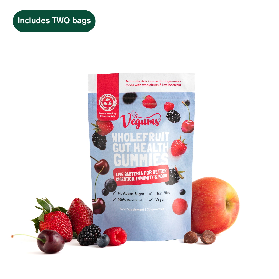 Vegums wholefruit gut health gummies packaging with fruits on a white background