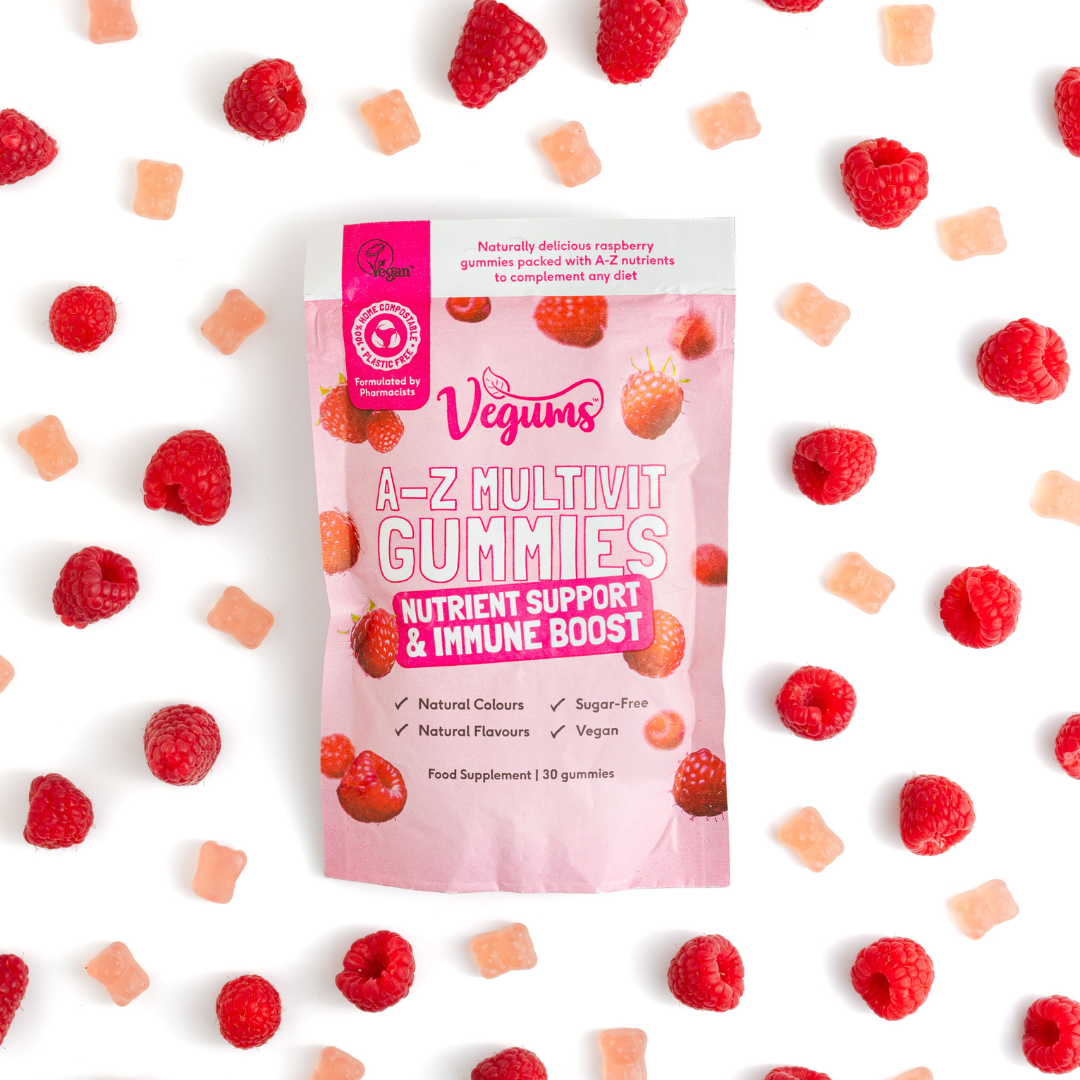 Vegums A-Z Multivit Gummies package with raspberries and gummy bears on a white background