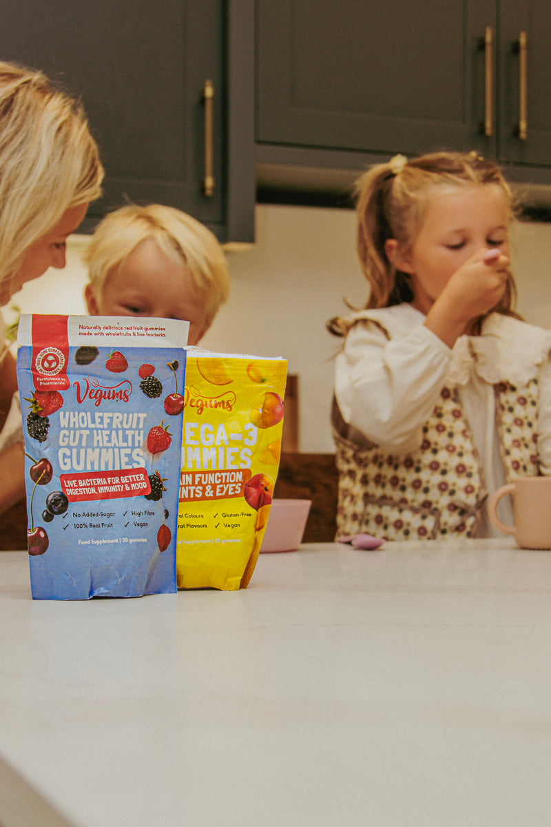 VGKIDS04 Mum and child taking Vegums gummies together
