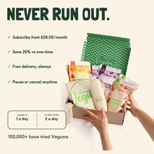 Hands unpacking a Vegums subscription box of five kids gummy vitamin pouches